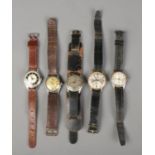 A collection of five vintage mechanical watches. Ware to straps and scratching to glass