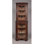 An Edwardian mahogany astragal glazed corner cupboard. Height 208cm, Width 74cm.