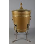 A 19th century brass coal bucket. Raised on four scrolled support, with twin ring handles and having