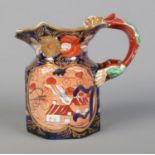 An early 19th century Masons Ironstone jug decorated in the School House design and having dragon