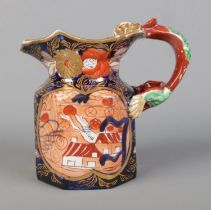 An early 19th century Masons Ironstone jug decorated in the School House design and having dragon