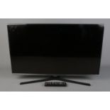 A Samsung 32" flat screen television with remote.