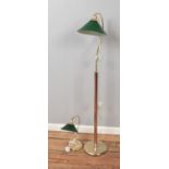 Two brass lamps with green glass shades including floor and desk lamp.