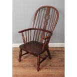 A 19th century ash/elm windsor arm chair with pierced back decoration.