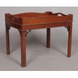 A 19th century mahogany tray top table raised on four square cut legs. Height 52cm, Width 66cm,