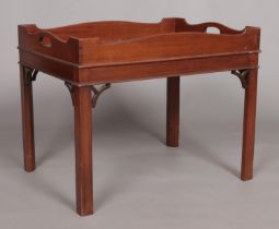 A 19th century mahogany tray top table raised on four square cut legs. Height 52cm, Width 66cm,