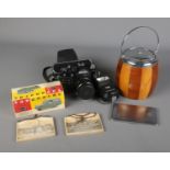 A mixed quantity of collectables including a biscuit barrel, Richmond cigarette case, Zenit 11