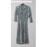 A Lee Bender at Bus Stop crushed velvet midi-dress featuring 3/4 and button front closure. Size 12.