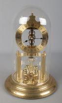 A Haller torsion clock under glass dome.