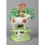 A 19th century Staffordshire spill vase by John Walton, bocage group with ram and lamb. Height 18cm.