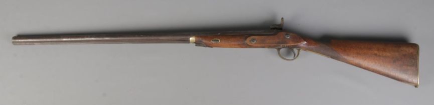 A 19th century percussion rifle with walnut stock and brass mounts. Having Birmingham proof marks to