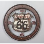 A rustic style Route 66 metal wall clock. Diameter 60cm.