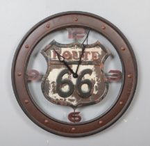 A rustic style Route 66 metal wall clock. Diameter 60cm.