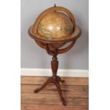 A globe on mahogany stand with star sign border. Approximately 90cm.