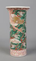A mid 20th century Chinese sleeve decorated in coloured enamels with dragons. Height 18cm.