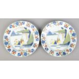 A pair of 18th century London Delft polychrome plates, both decorated with a seated Chinese man