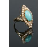 An 18ct gold turquoise and seed pearl navette ring. Size P 1/2. 6.91g.