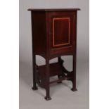 An Edwardian mahogany side cabinet with book trough under tier. Height 76.5cm, Width 35.5cm, Depth