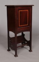 An Edwardian mahogany side cabinet with book trough under tier. Height 76.5cm, Width 35.5cm, Depth