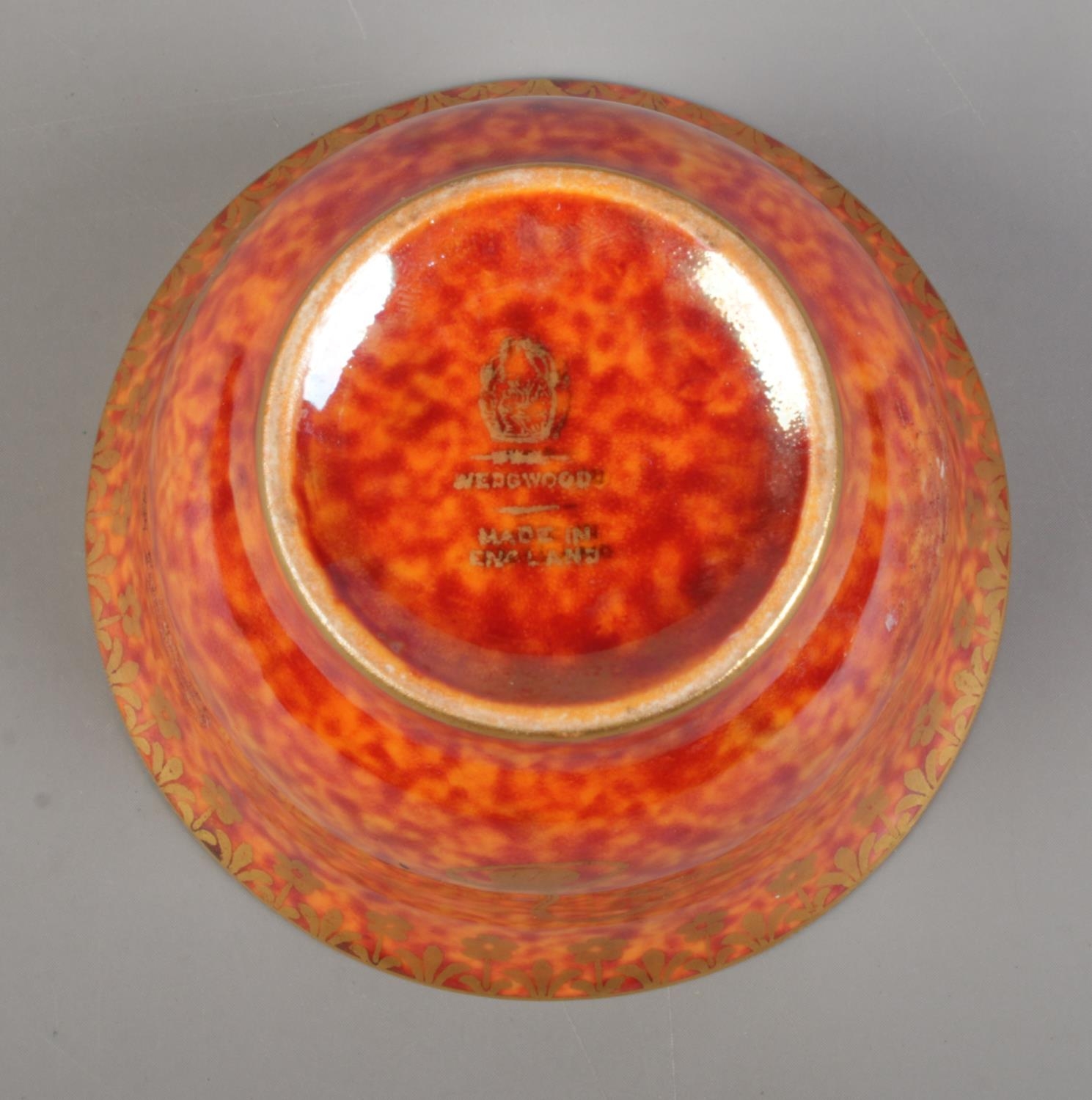 A Wedgwood Lustre miniature bowl by Daisy Makeig Jones, decorated with motifs. Having mottled orange - Image 3 of 3