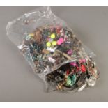 A large bag of costume jewellery.