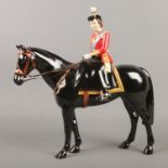 A Beswick 'Trooping the Colour' limited edition figure modelled as Queen Elizabeth II riding a