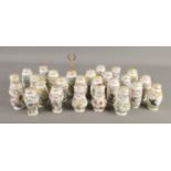 A collection of Lenox porcelain storage jars, decorated with birds and flowers.