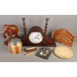 A collection of treen. Includes Maxim mantel clock, barley twist candlesticks, carved elephant etc.
