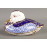A Royal Crown Derby paperweight in the form of a duck, in Imari colours. With silver stopper.