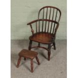 An early Victorian yew wood child's/doll's Windsor chair, featuring crinoline stretcher along with