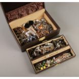 A jewellery box containing costume jewellery earrings, necklaces, bracelets etc.