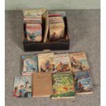 A box of mostly Enid Blyton books to include several fist edition copies. Titles include The