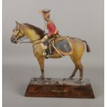 An antique composite figure formed as a military soldier on horseback, base stamped 16th Lancers