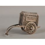 A late nineteenth/early twentieth century silver shaker in the form of a rickshaw, with moving