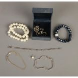 A small collection of mostly costume jewellery to include three silver bracelets and single 9ct