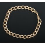 A gold plated chain link bracelet.