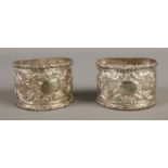 A pair of 925 silver napkin rings, with scrolled and foliate detailing. Total weight: 35.4g
