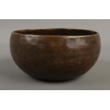 A Tibetan singing bowl featuring Sanskrit decoration. Approx. diameter 15cm.