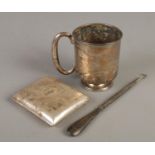 Three pieces of silver. Includes tankard, cigarette case and a button hook. (152g weight of