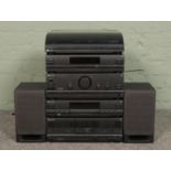 A Phillips stacking stereo system, featuring record player, CD player and tape deck. Together with a