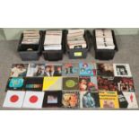 Four boxes of single vinyl records. Includes Queen, Status Quo, Meat Loaf, Alice Cooper, UB40,