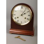 A Woodford 8 day, dome shaped mahogany mantel clock with Franz Hermle movement. (22cm) In working