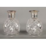 A pair of Mappin and Webb silver and tortoise shell topped glass scent bottles. Hallmarked