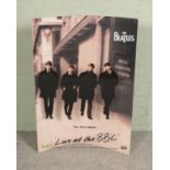 A 3D shop display promotional poster of The Beatles