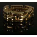 An 18ct gold panther link ring. Size T, 10.49g.