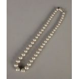 A Mexican silver graduated bead necklace. Stamped 925 to clasp, total weight 75.1g. Unclasped length