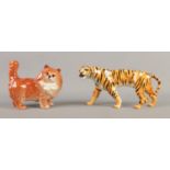 Two Beswick pottery figures formed as a Tiger and long haired Cat.