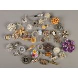 A large collection of costume jewellery brooches.