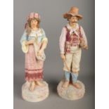 A pair of Robinson and Leadbeater ceramics figures formed as musicians, one with violin and one with