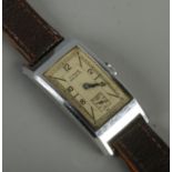 A gents stainless steel Titus Geneve manual wristwatch. Watch case 4.2cm x 2.3cm. Running.